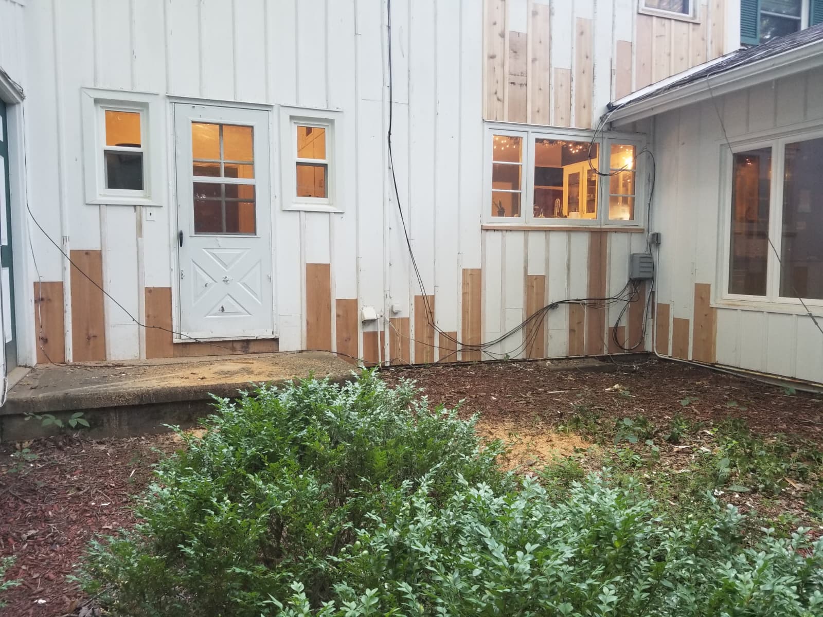 Exterior wall painting and siding restoration project